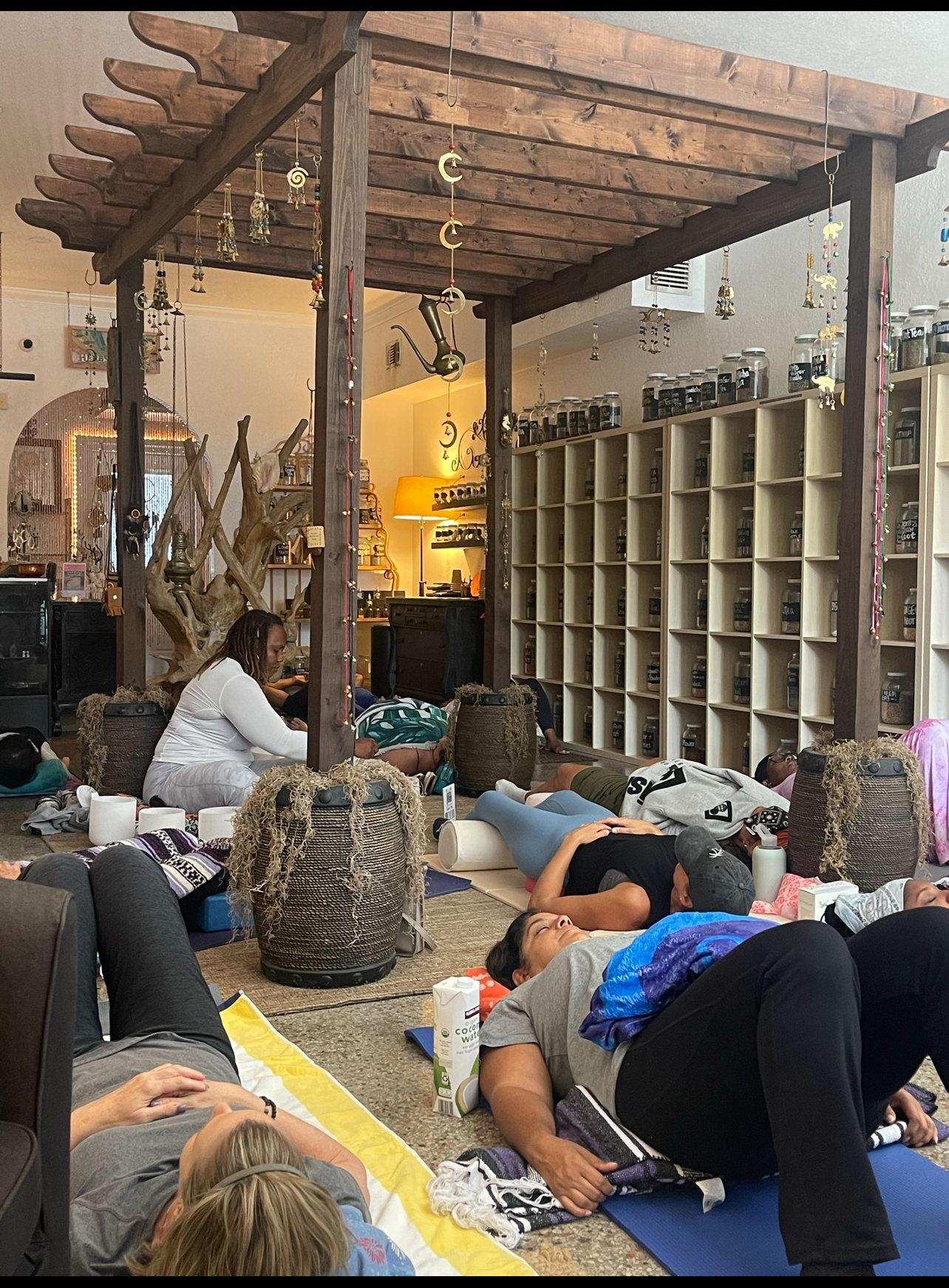 Dr. Asia leading a sound bath at Herbs and Earth in Northwood, West Palm Beach