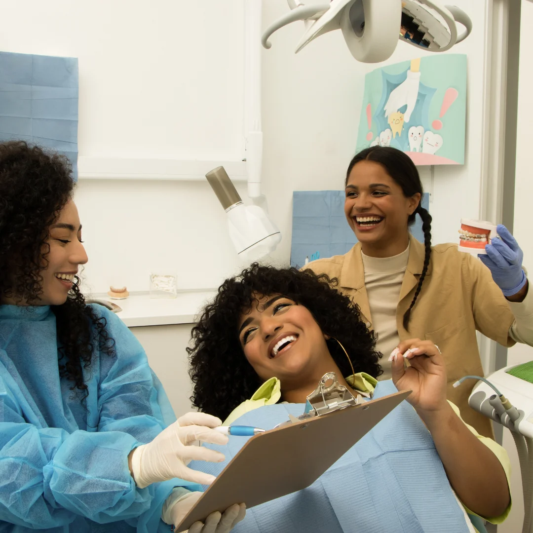 Healthcare team and patient sharing a positive moment at a clinic