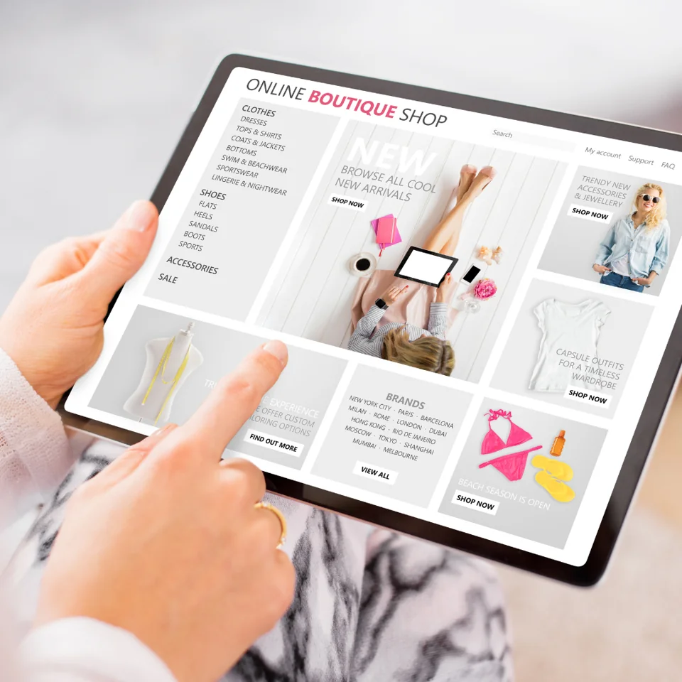 Retail employee preparing a stylish display of products for customers