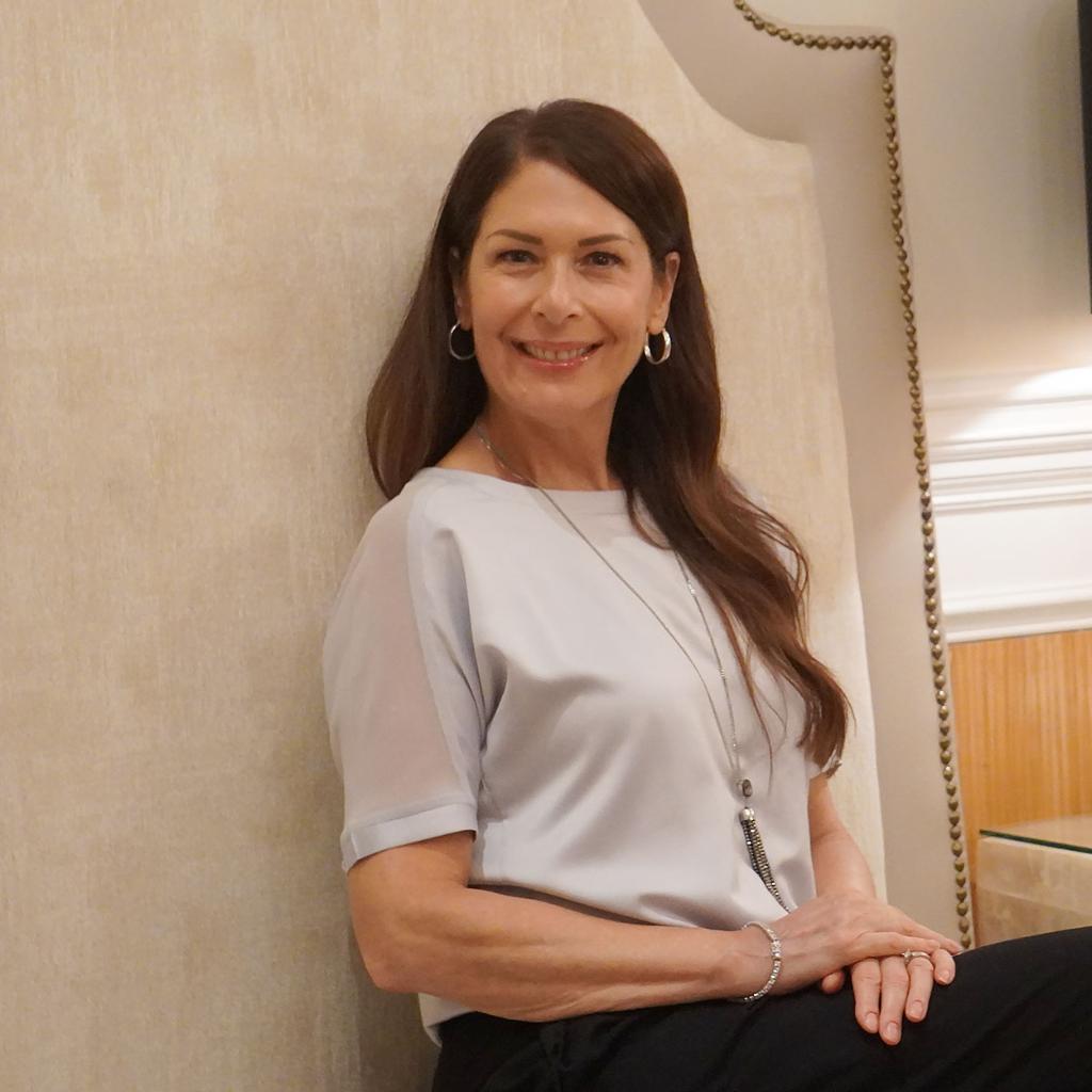 Teresa, smiling woman with long brown hair, wearing a light gray blouse and silver jewelry, seated indoors against a neutral background. Featured in Boss Life Journal Side Gig Stories blog post about her transformation from skeptic to success. Teresa, smiling woman with long brown hair, wearing a light gray blouse and silver jewelry, seated indoors against a neutral background. Featured in Boss Life Journal Side Gig Stories blog post about her transformation from skeptic to success.