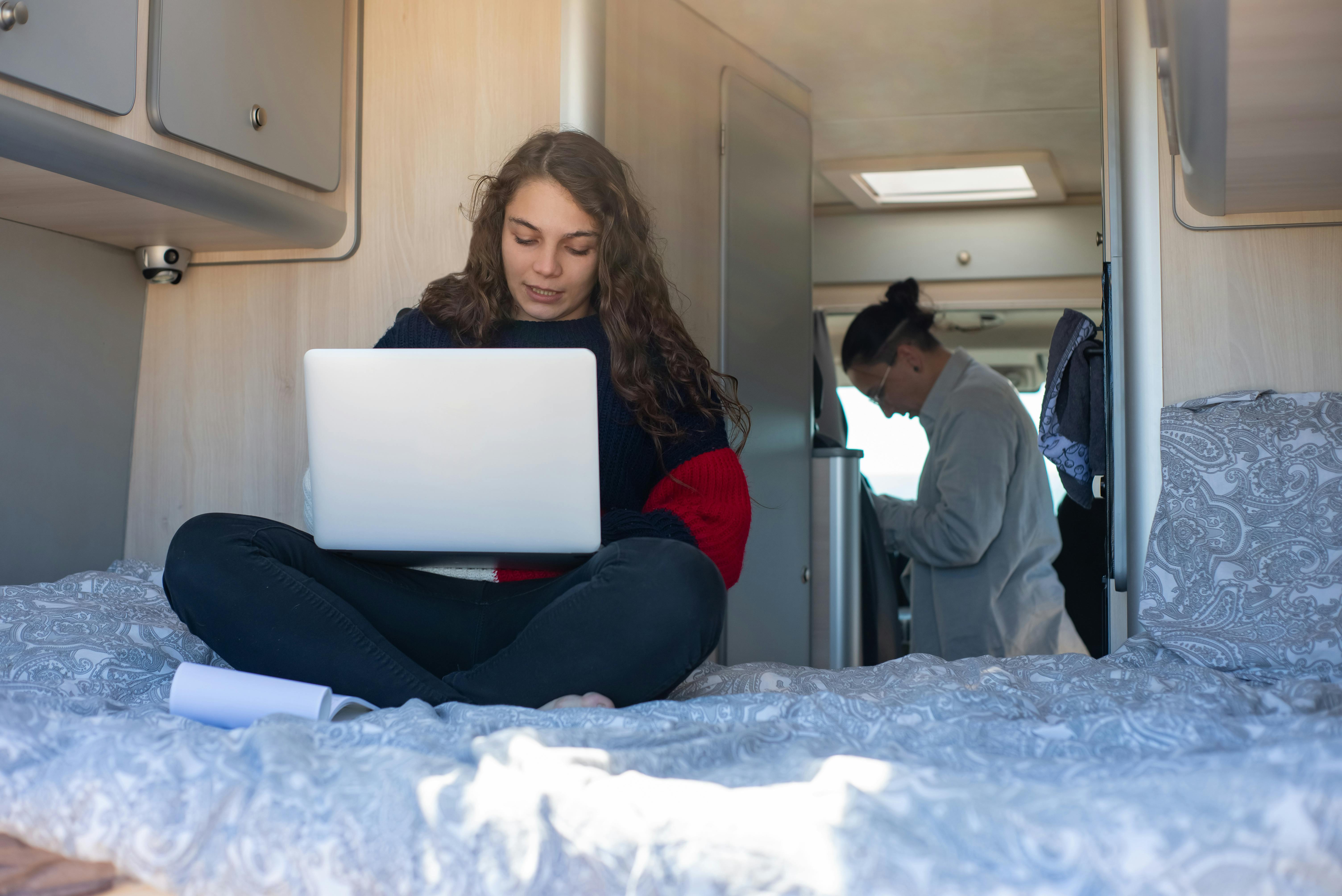 Person using device inside RV