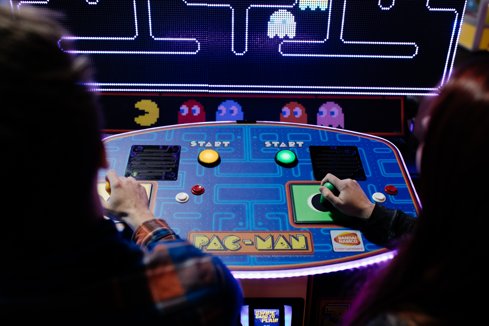 Couple playing World's Largest Pac-Man at Action City