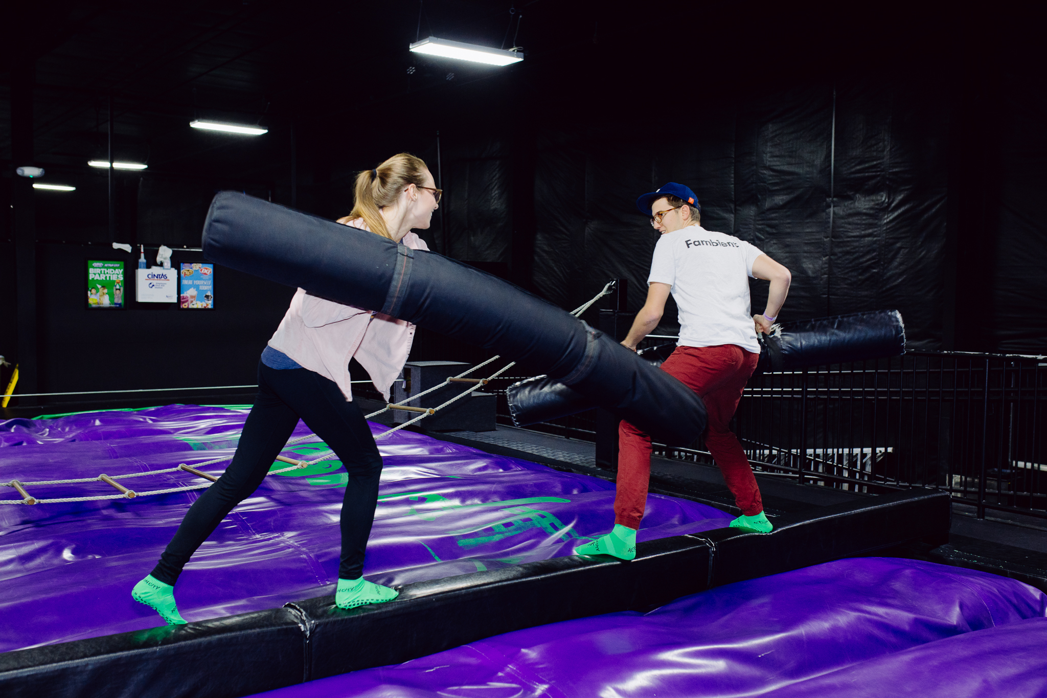 People jousting in the trampoline park