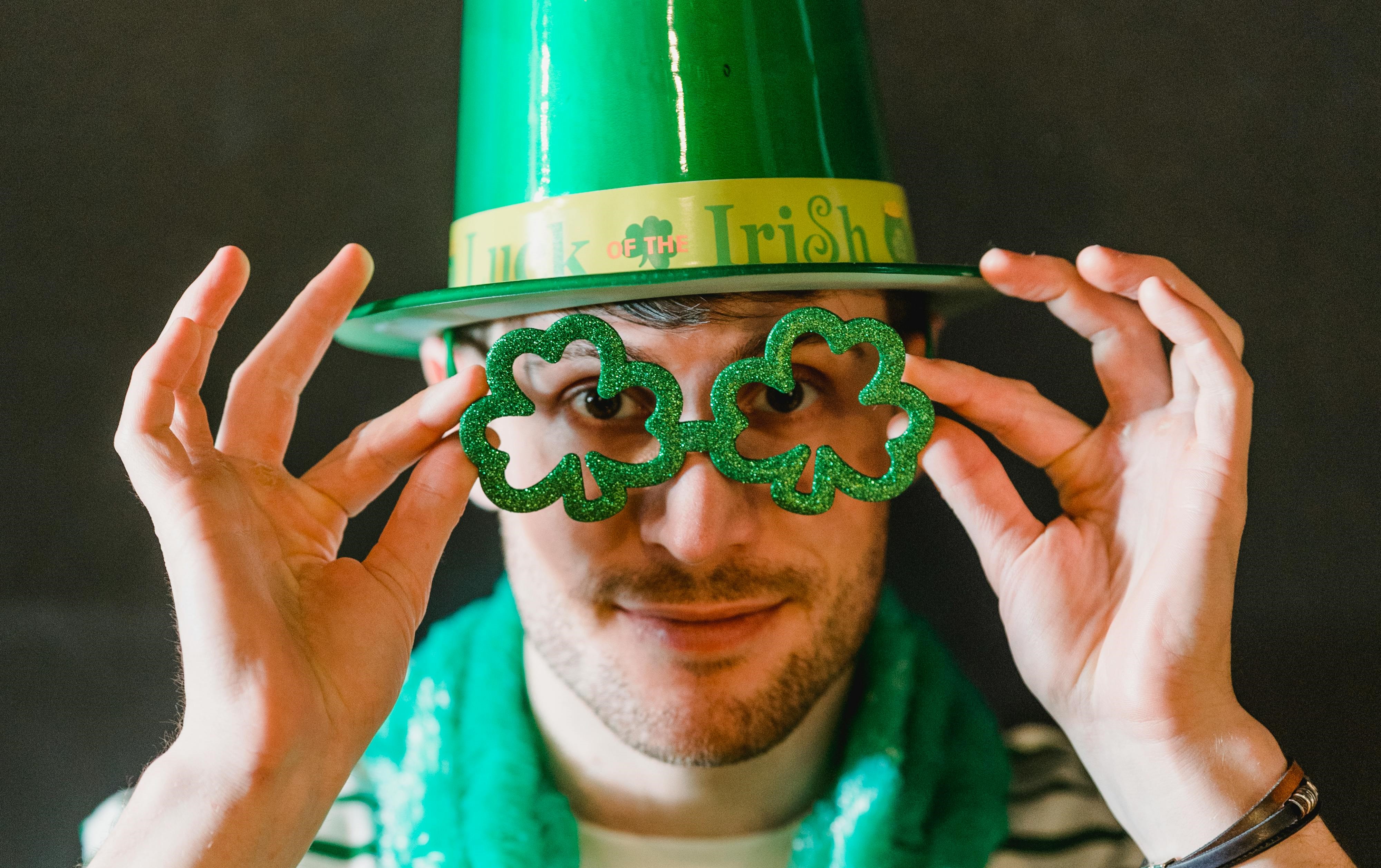 Man wearing shamrock glasses for St. Patrick's Day