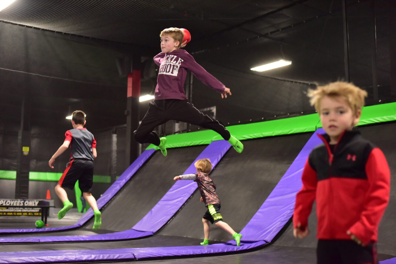 Kids playing dodgeball in Action City's trampoline park