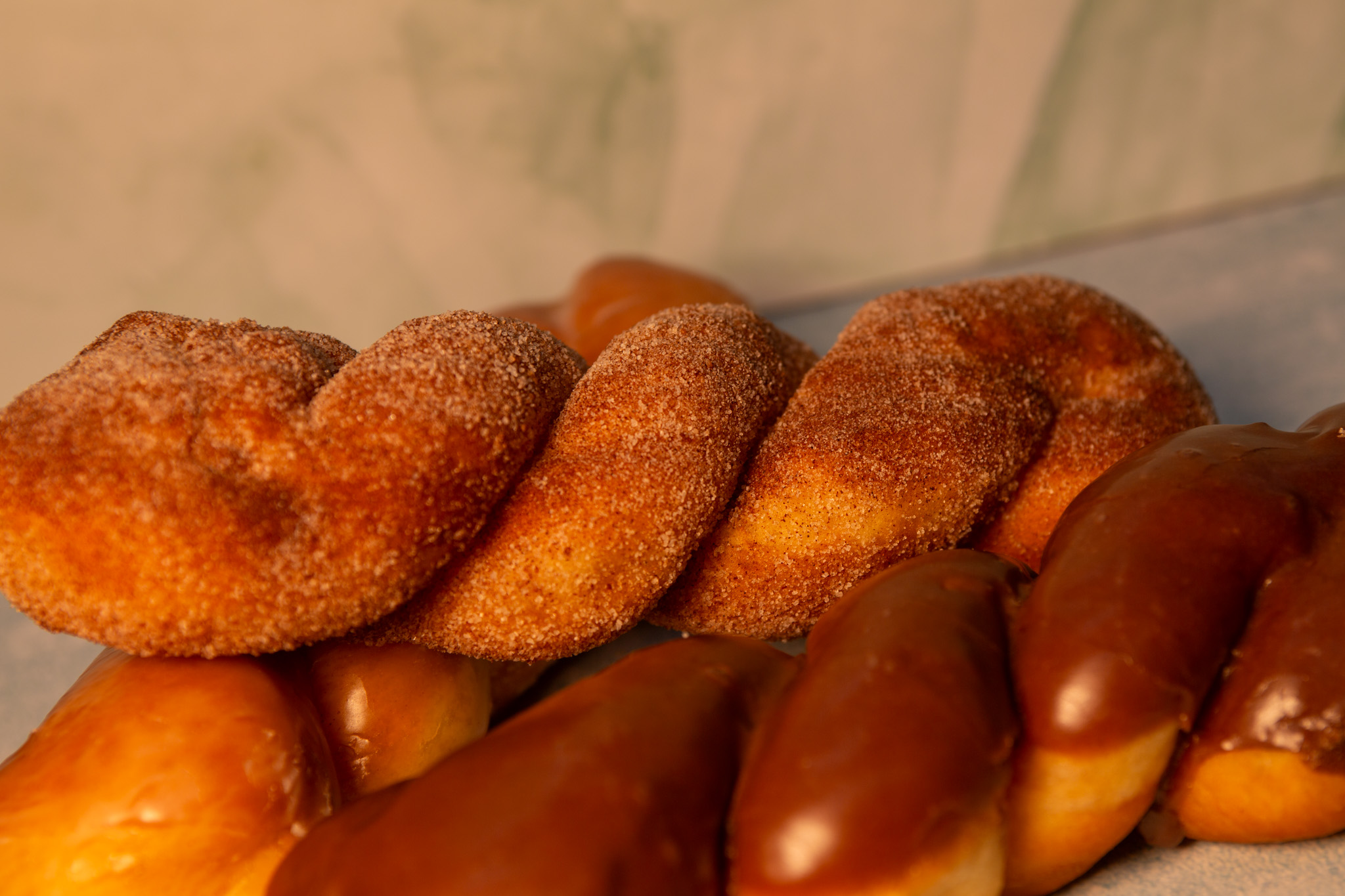 Fresh donuts arranged in display case