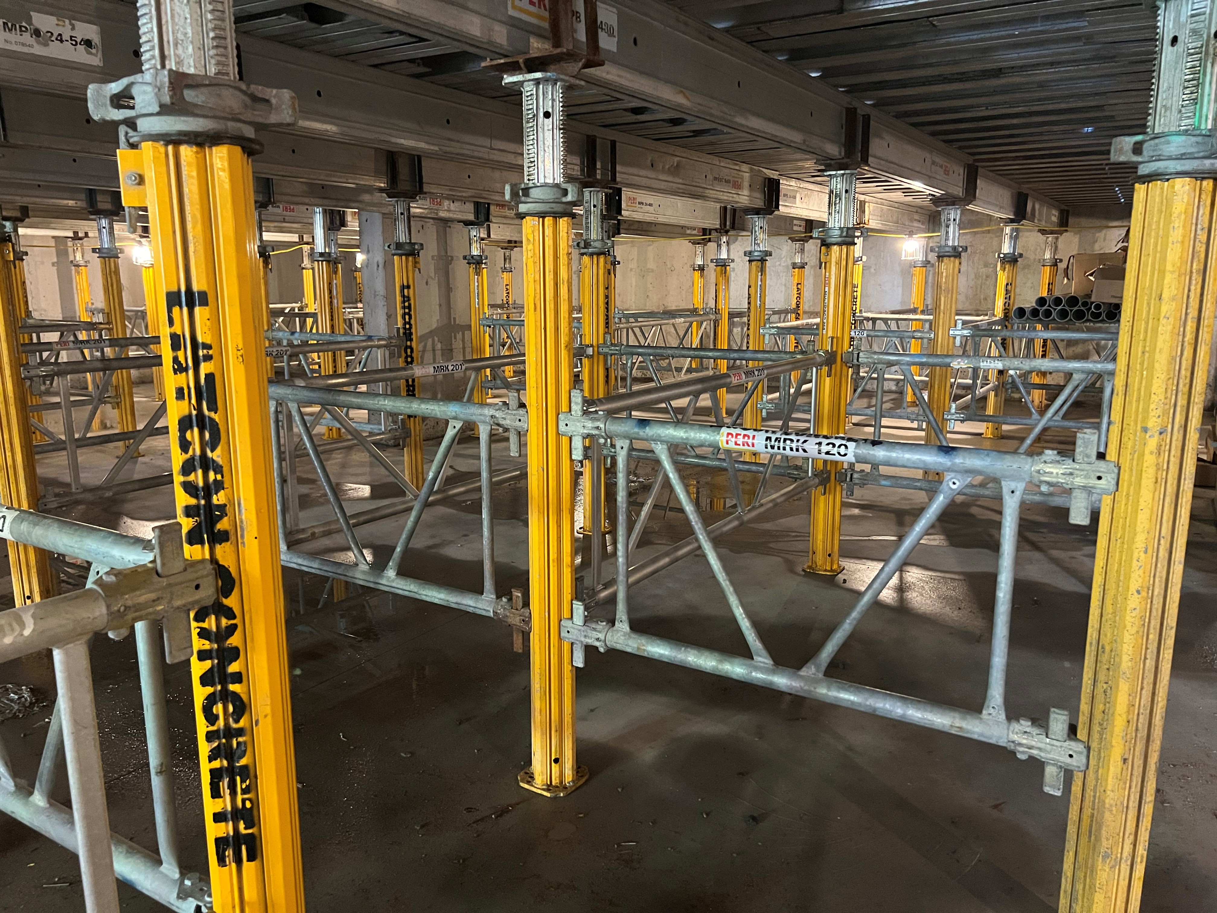 Concrete shoring system with PERI props and frames set up for slab support during commercial construction by Latcon Ltd. in Ottawa, Ontario.