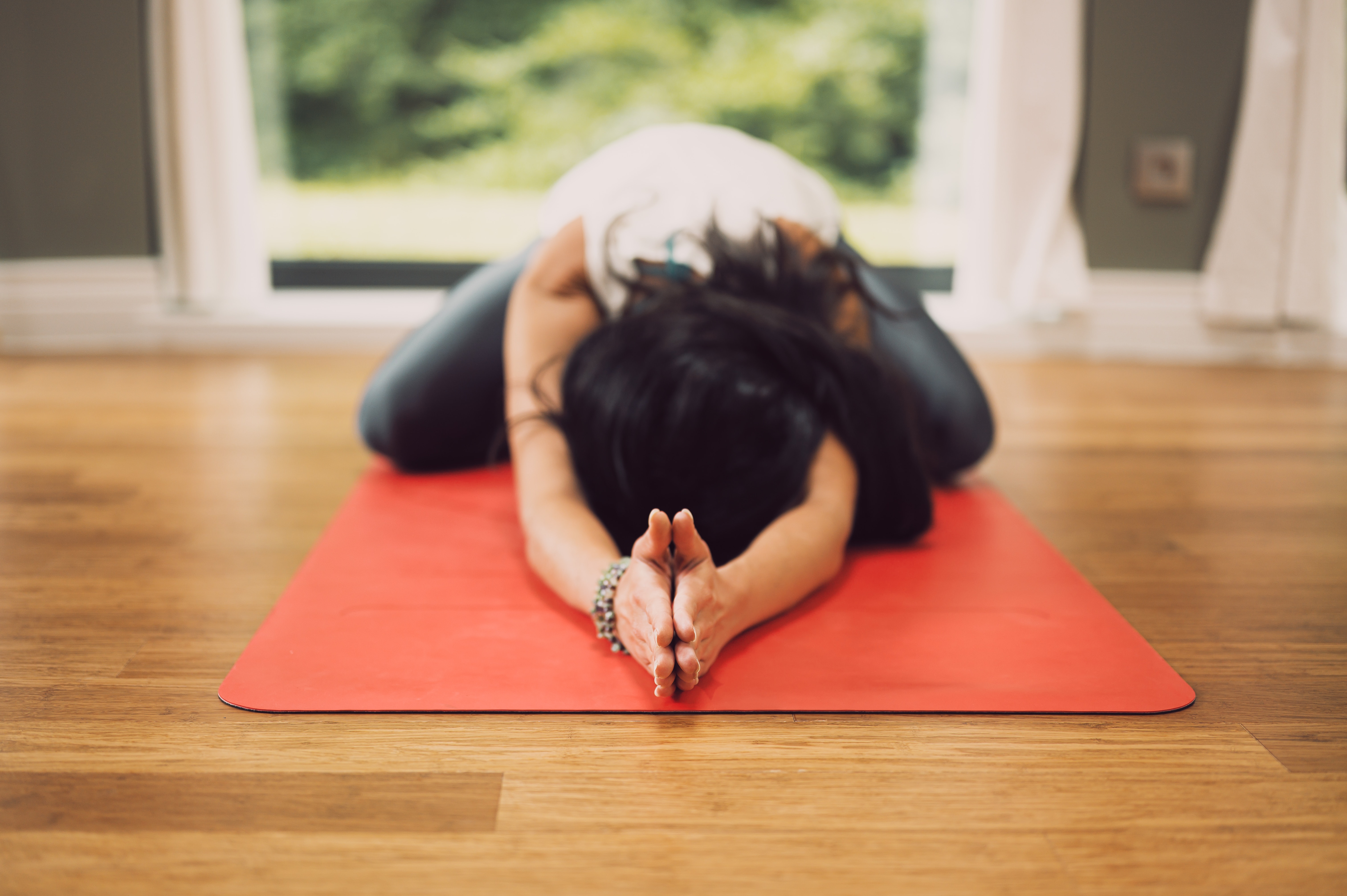 Woman in yoga childs pose 
