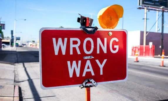 red wrong way sign