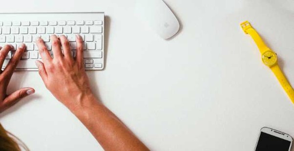 woman writing on laptop - office work