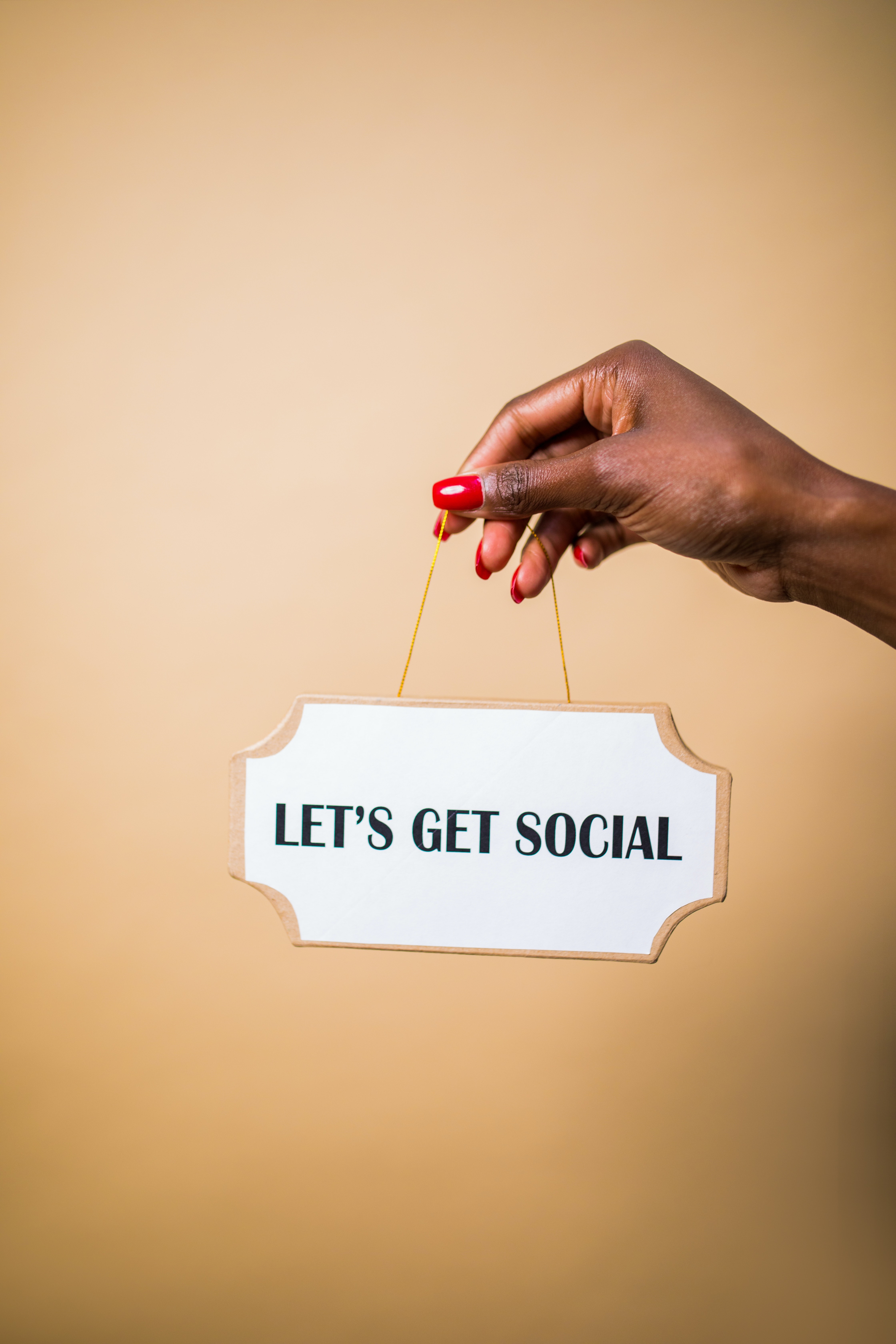 let's get social slogan written on a label hold by woman