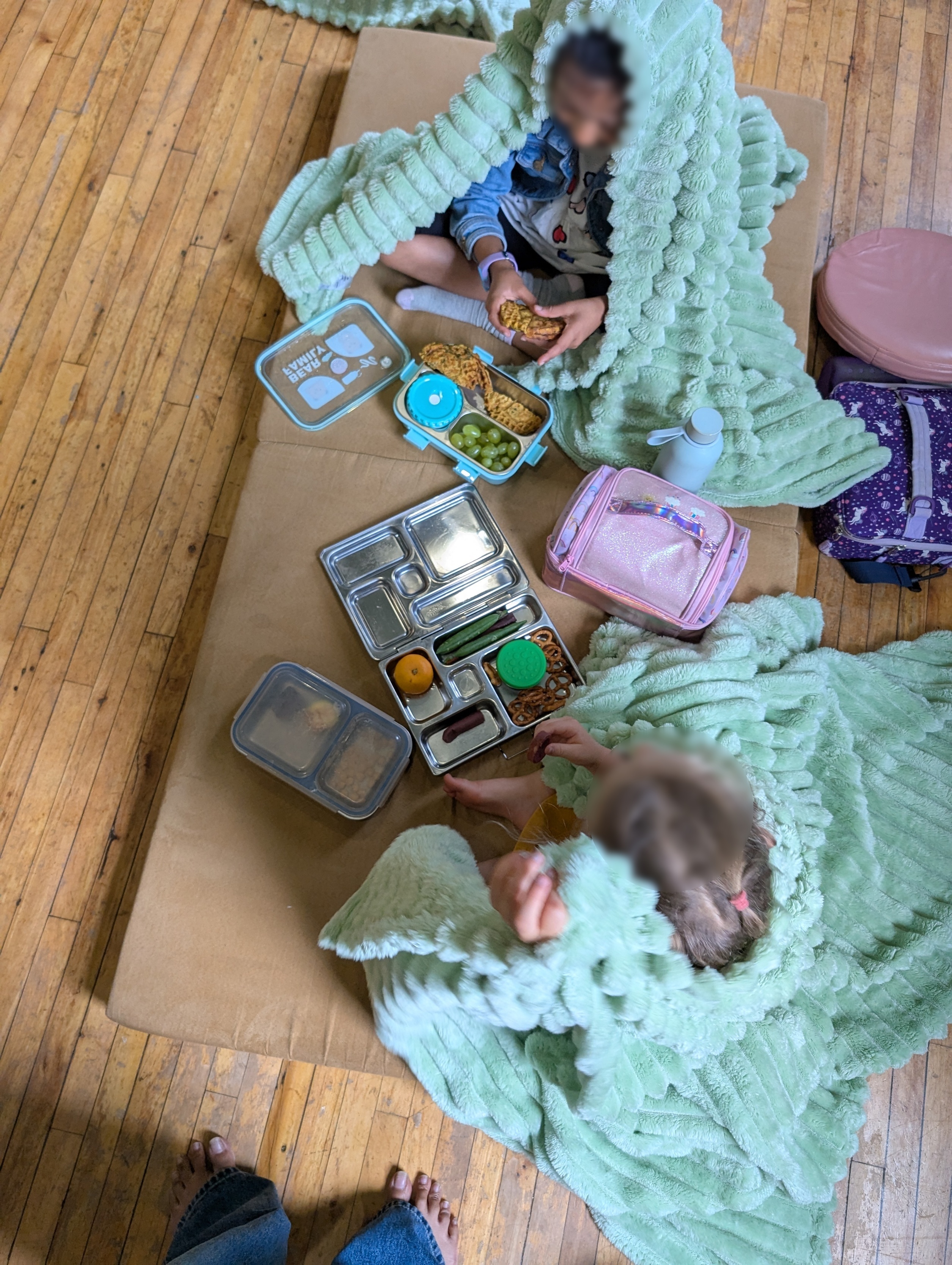 Children having a lunch picnic in the lunch fort