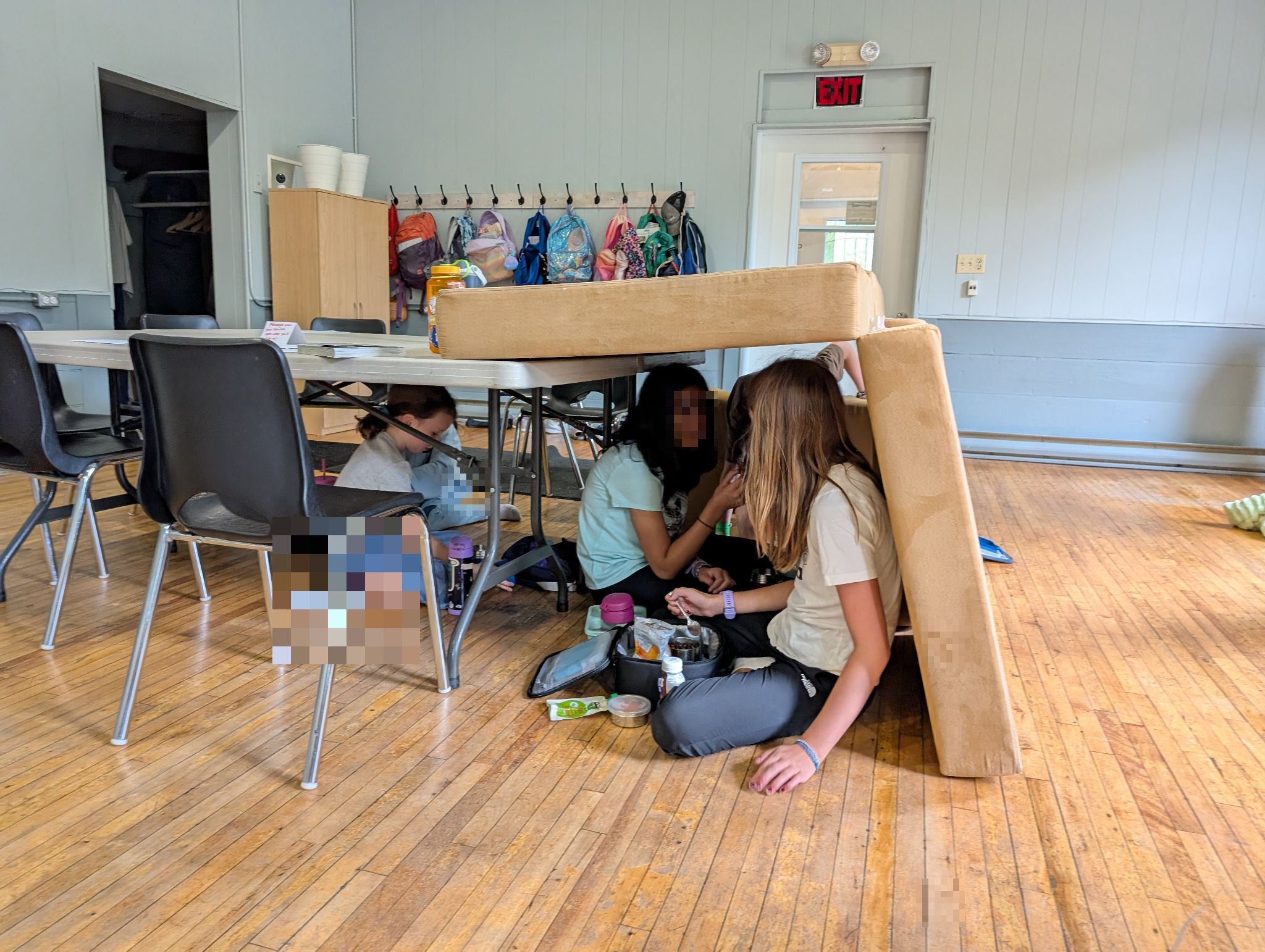 Learners built a lunch fort using cushions and blankets found in the studio.