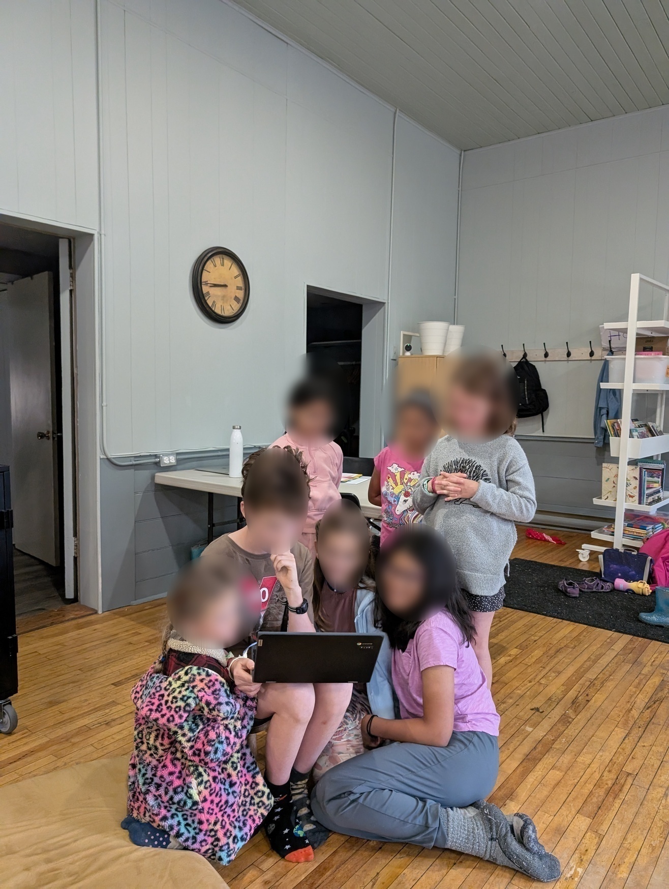 Children looking at lip dub videos and voting on them