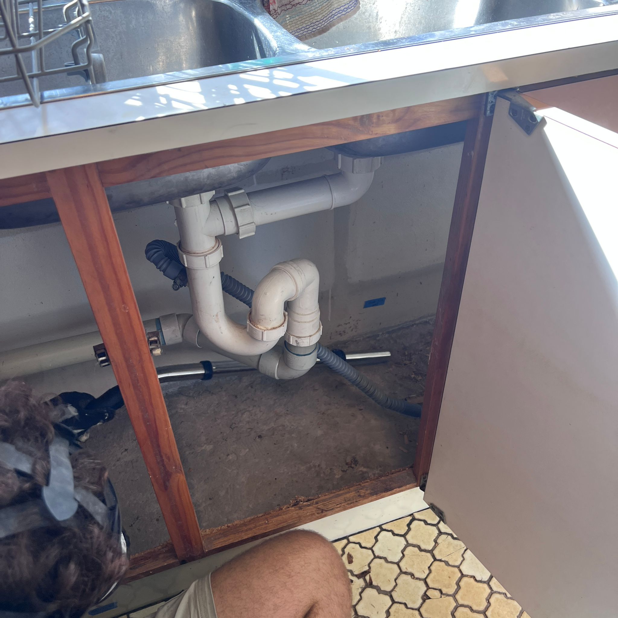 Under-sink kitchen cabinet after shelving removal