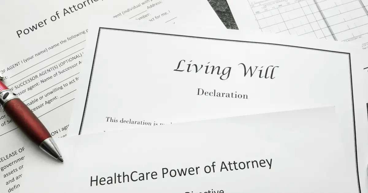 A set of estate planning documents, including a Living Will, HealthCare Power of Attorney, and Power of Attorney forms, with a red pen resting on top. A set of estate planning documents, including a Living Will, HealthCare Power of Attorney, and Power of Attorney forms, with a red pen resting on top.