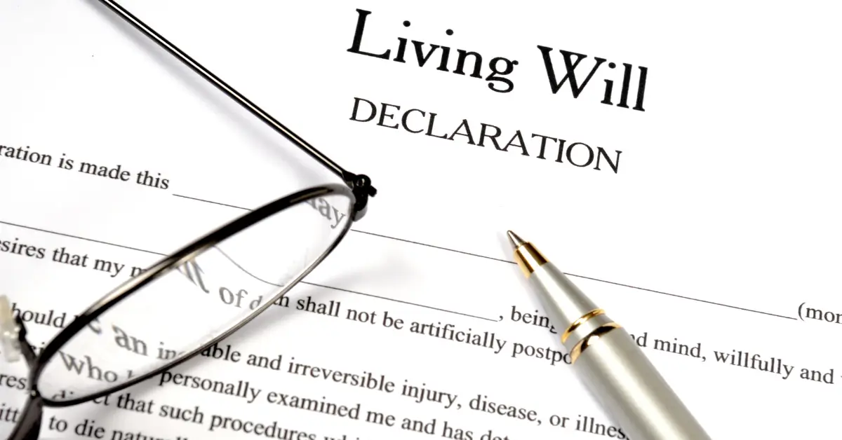 A document titled “Living Will Declaration” with a silver pen and a pair of eyeglasses resting on top.