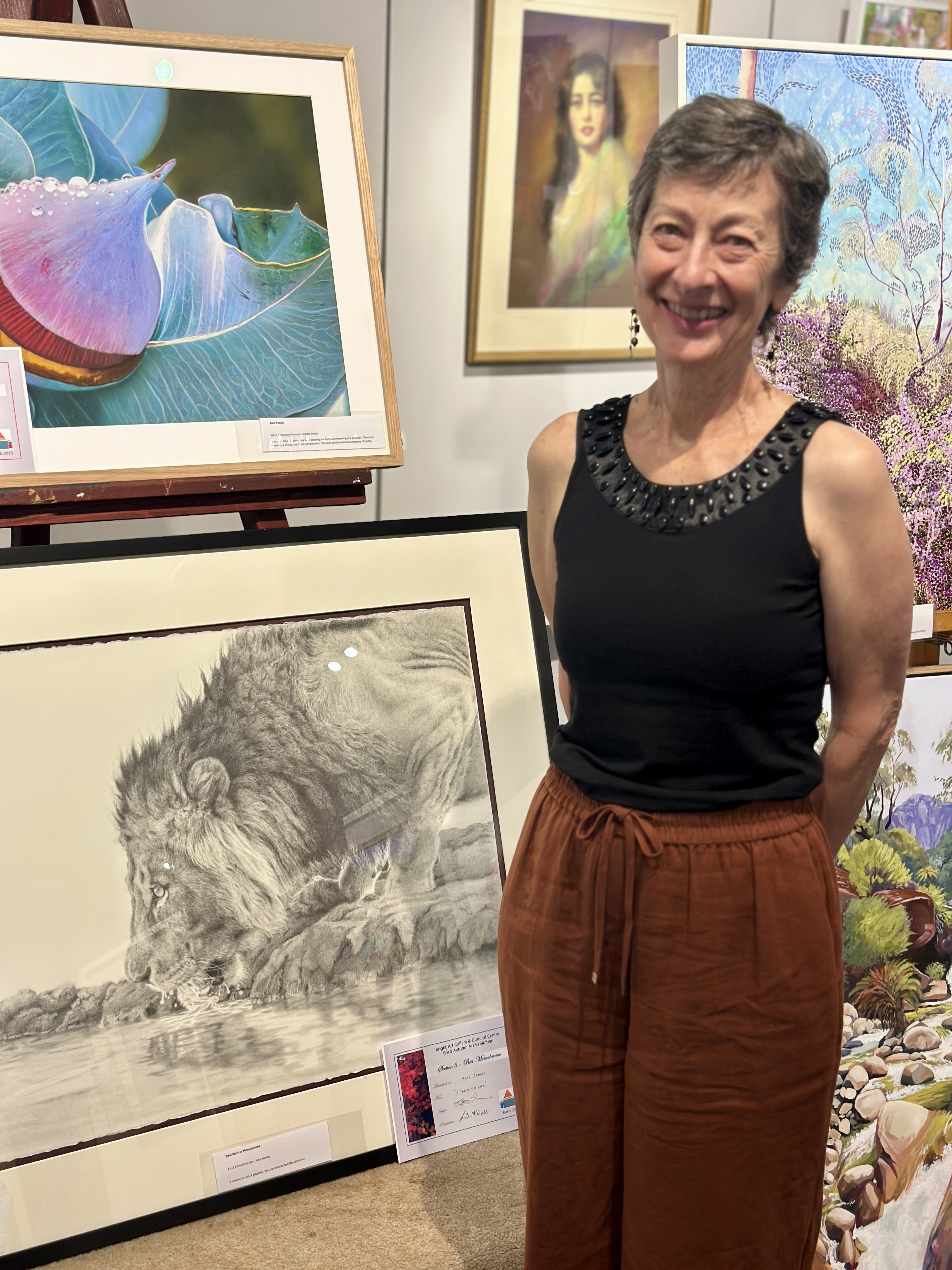 Award-winning graphite drawing of a lion drinking at a waterhole wins 1st prize at the Bright Autumn Art Show. See why the judge called it "masterful." Award-winning graphite drawing of a lion drinking at a waterhole wins 1st prize at the Bright Autumn Art Show. See why the judge called it "masterful."