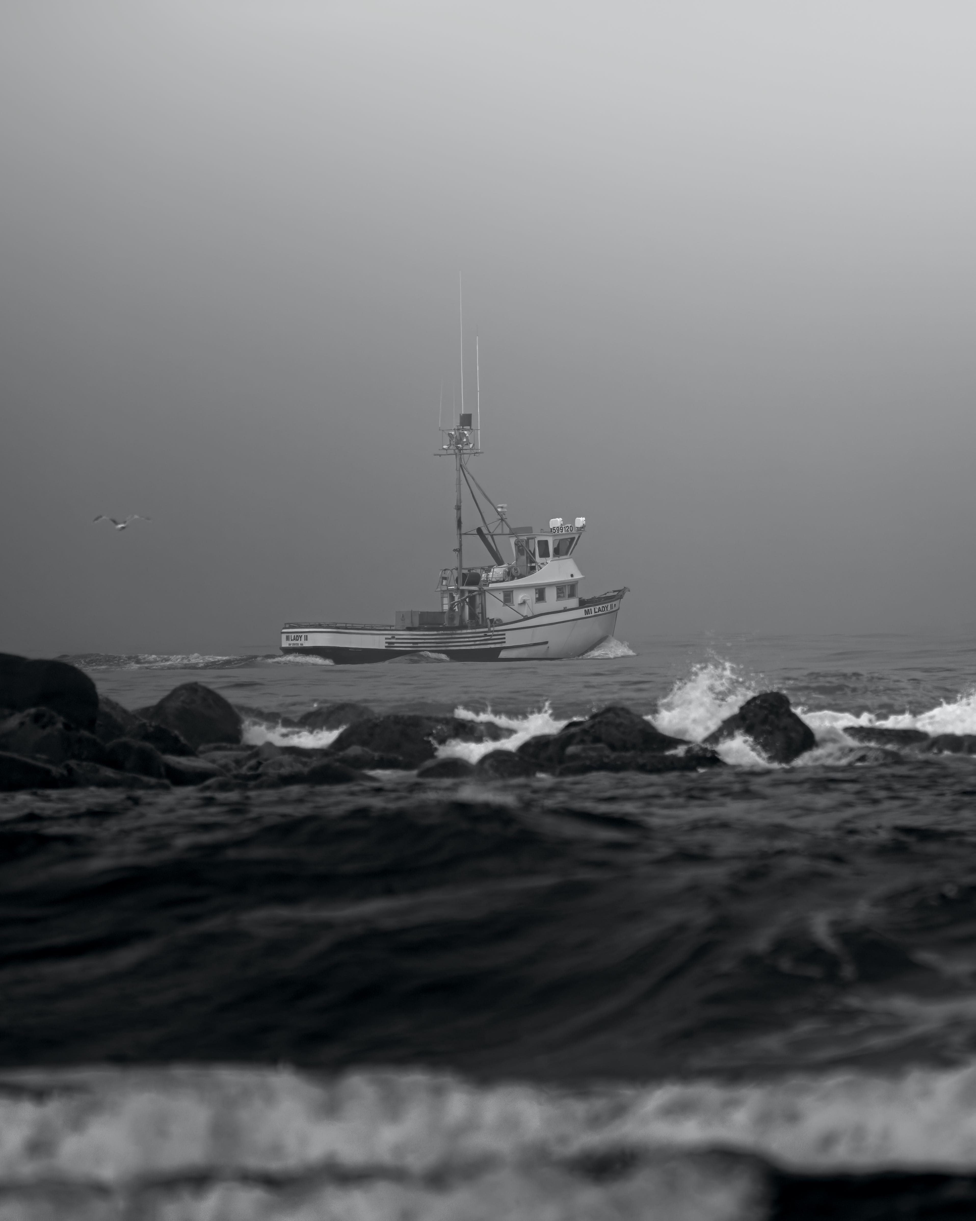 Sailing with a boat in the storm