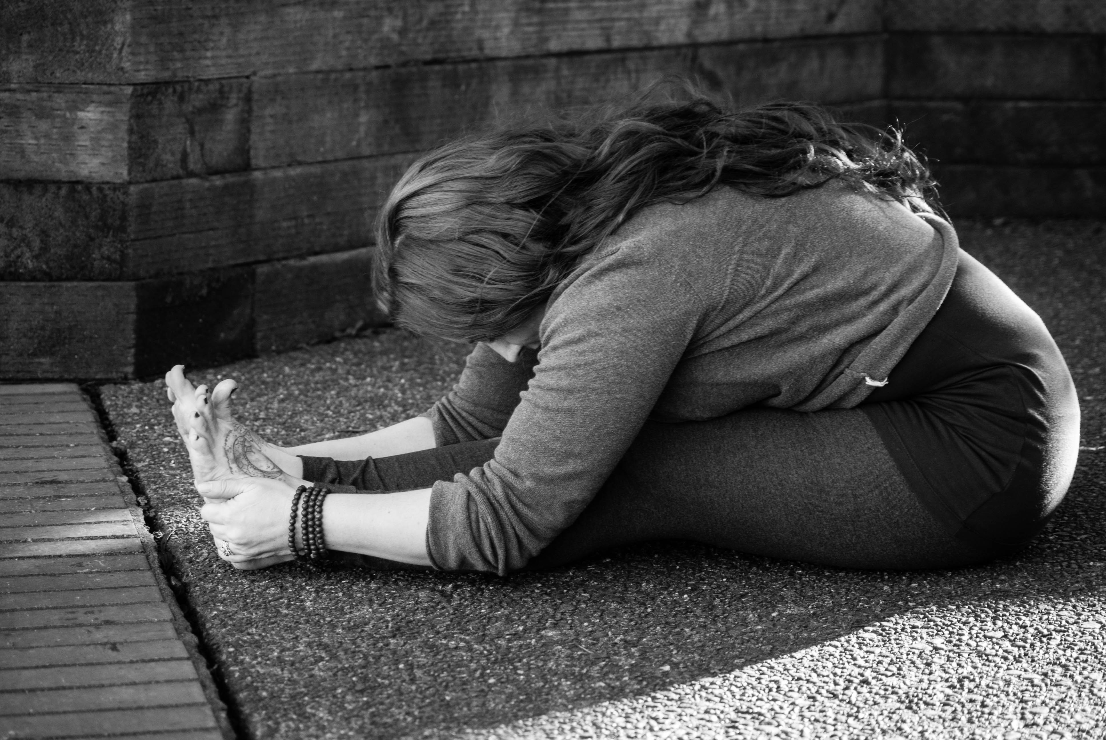 Margo with Yoga Yoga Pacific Northwest in Paschimottanasana, photo by Rachelle Ribail Photography