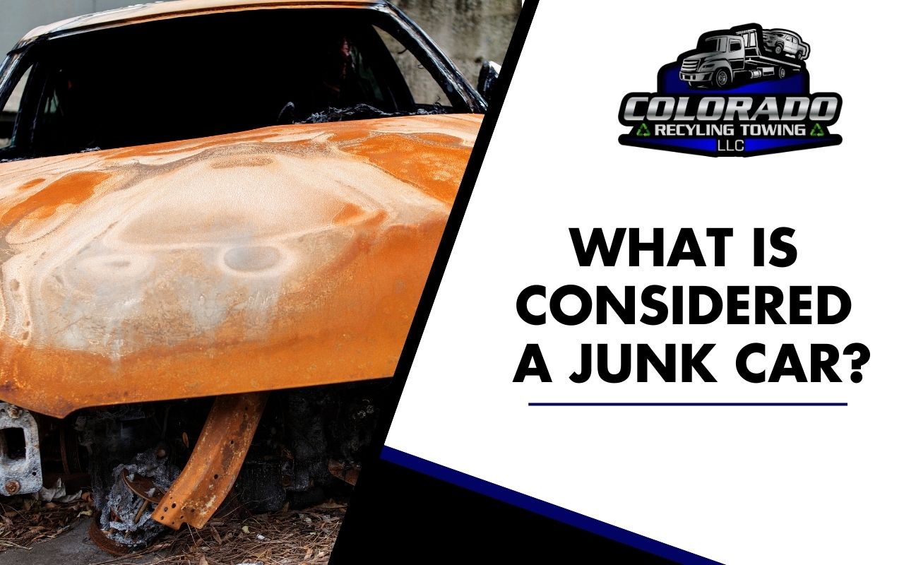 Old junk car parked in a Colorado driveway