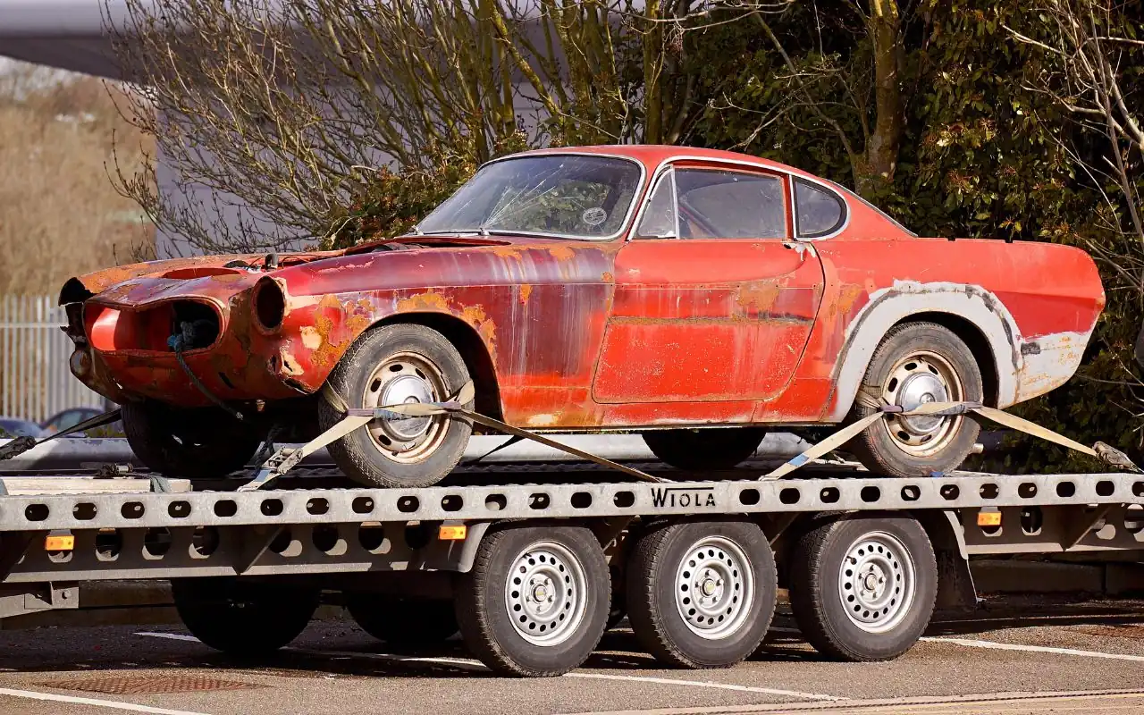 Towing a junk car and handing over cash payment Towing a junk car and handing over cash payment