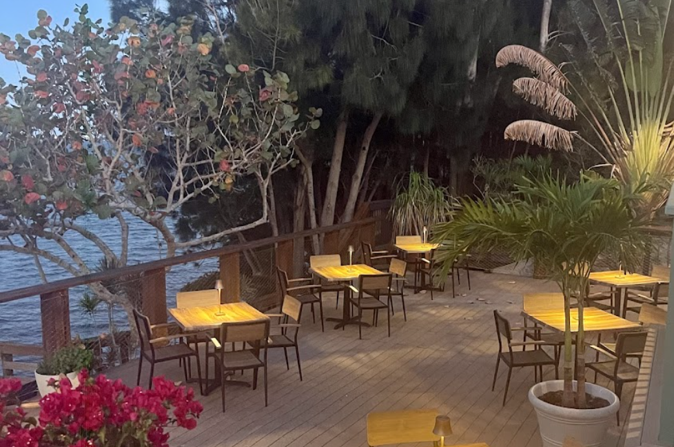 Exterior shot of The Brevardian Riverfront restaurant, showcasing its blend of modern elegance with Old Florida charm, and riverside views. Exterior shot of The Brevardian Riverfront restaurant, showcasing its blend of modern elegance with Old Florida charm, and riverside views.