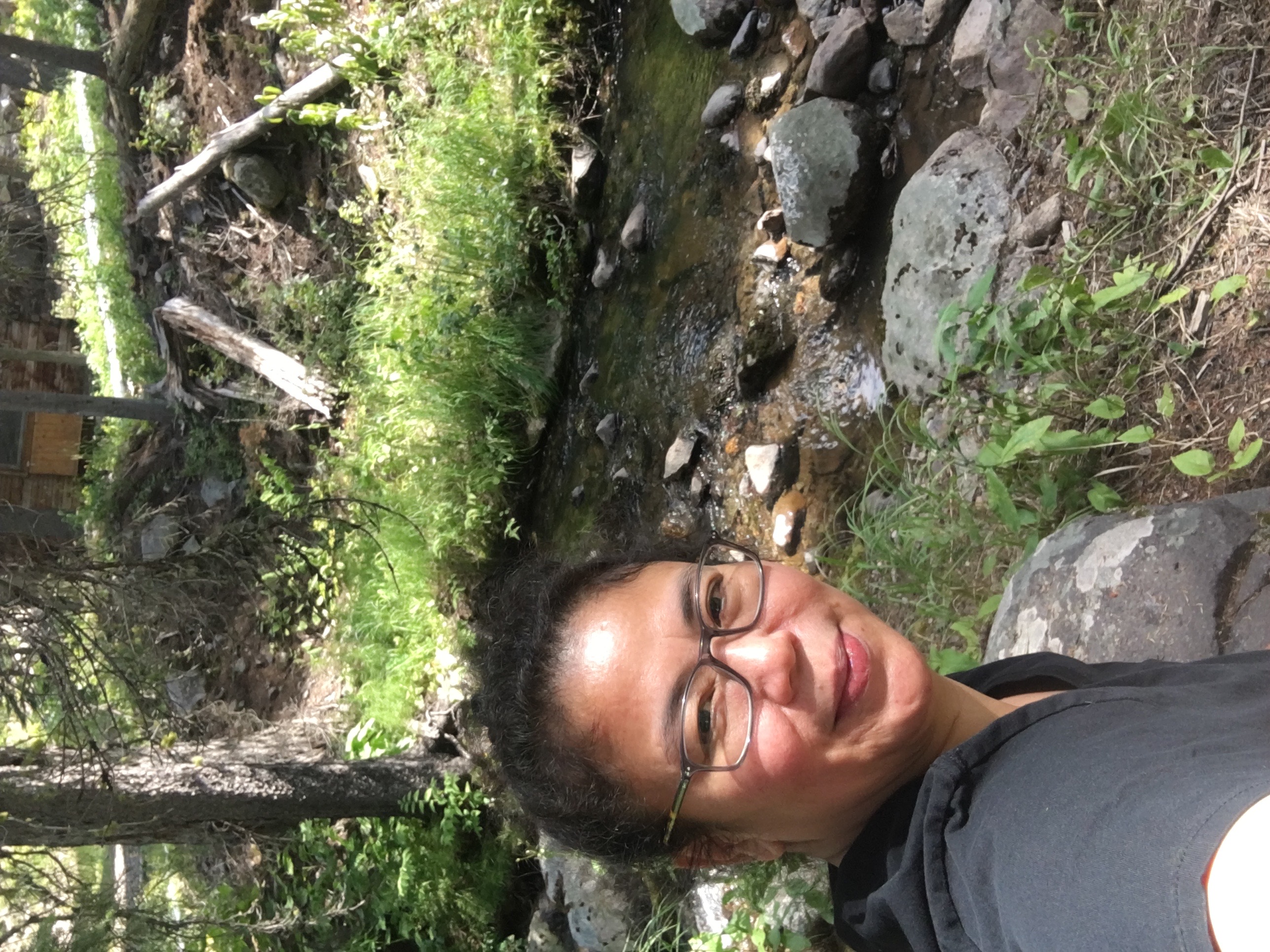 Artist at a creek — ACFA Creative House