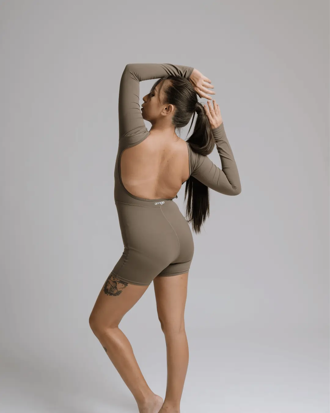 Bare Glow yoga onesie in black