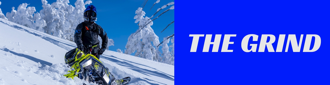 Cole Willford on the mountain on a snowmobile next to words that say 'The Grind'