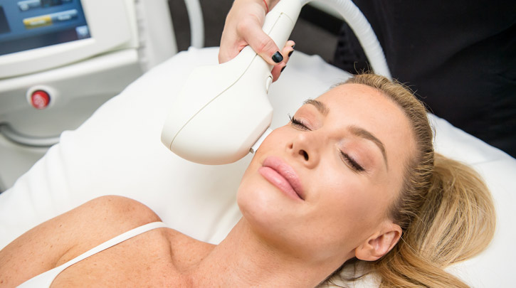 a woman getting a photofacial laser treatment on the face a woman getting a photofacial laser treatment on the face