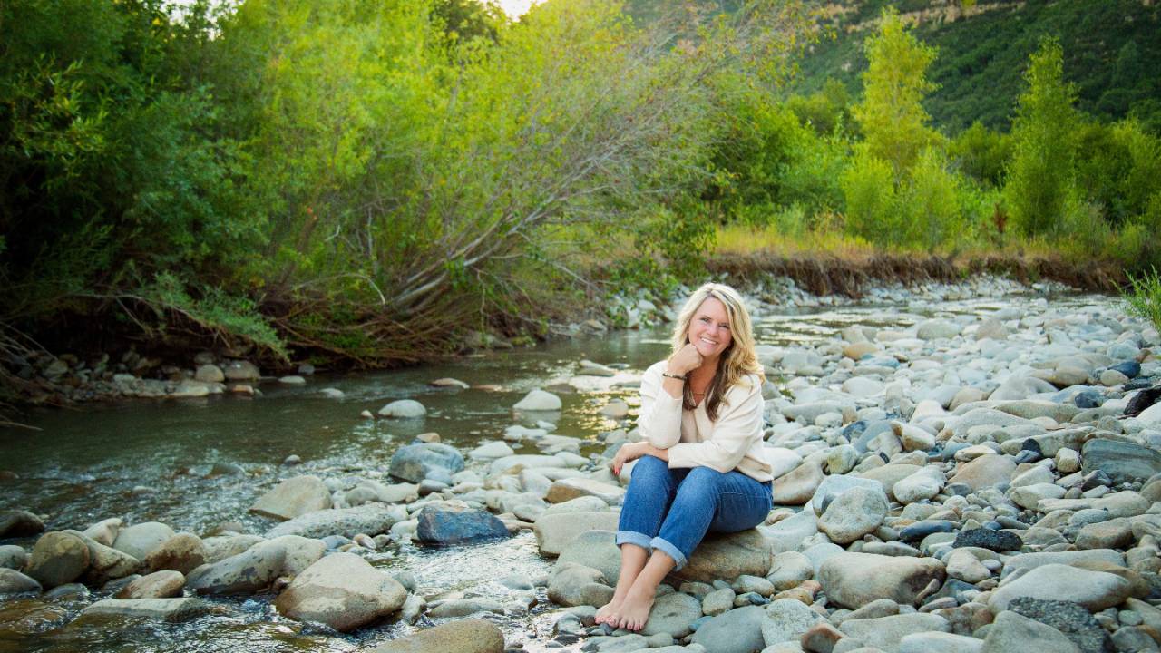 Midlife woman reflecting on personal growth at 57