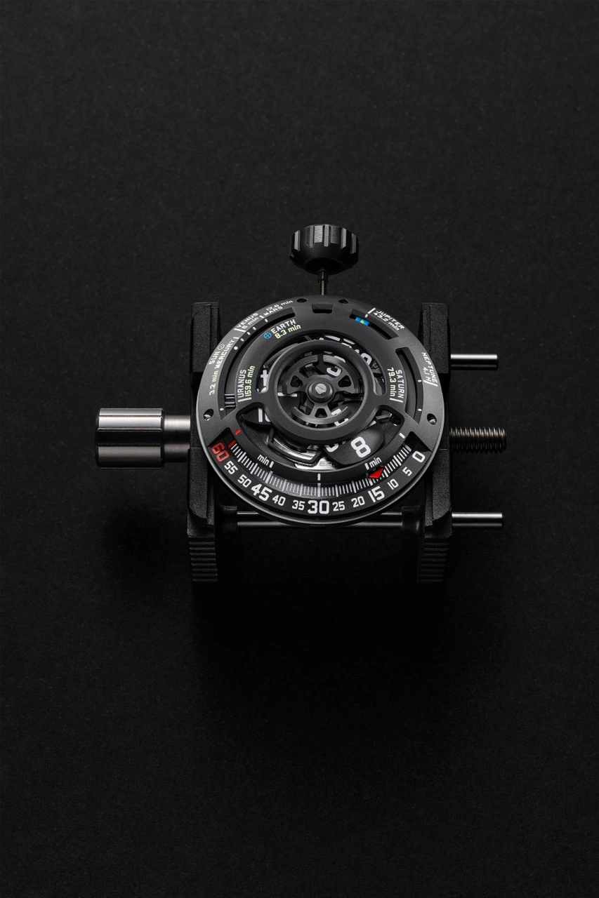 Side profile of the URWERK UR-100V LS Ceramic showing layered white composite case architecture