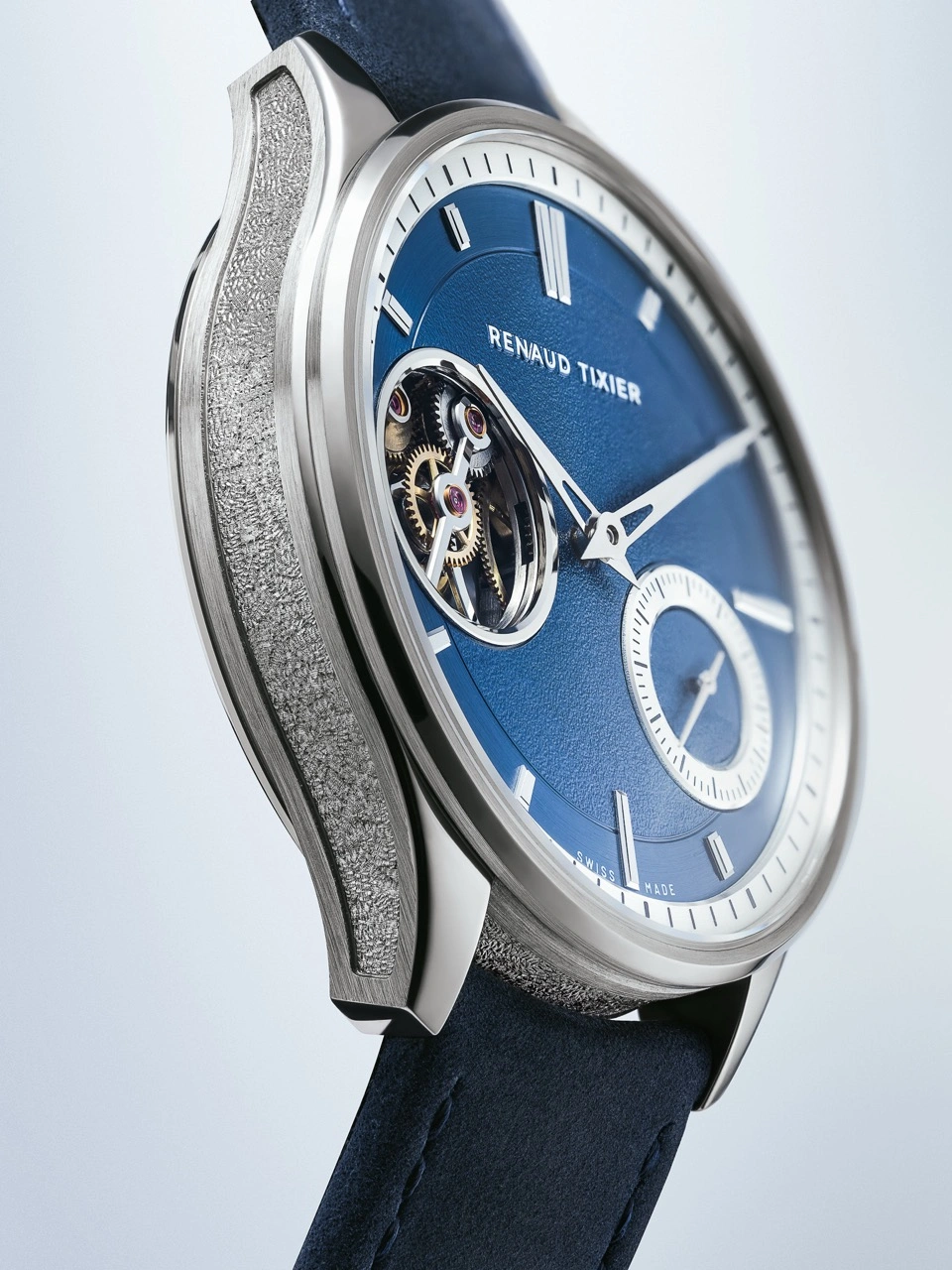 Close-up of the Renaud Tixier Monday blue petrol dial and applied indices