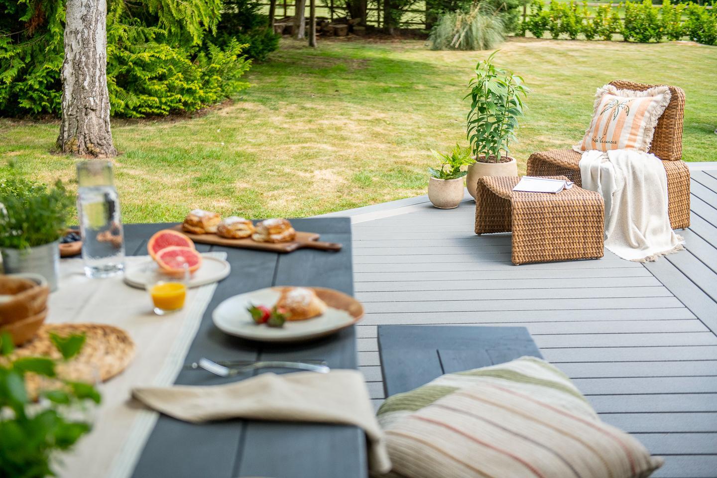 Trex Lineage Island Mist composite decking with Biscayne picture frame, installed by Beams & Braces in Norfolk featuring Trex Signature railing and Carpenters Mate fixings. Trex Lineage Island Mist composite decking with Biscayne picture frame, installed by Beams & Braces in Norfolk featuring Trex Signature railing and Carpenters Mate fixings.