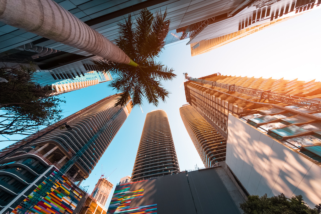 Skyscrapers in Miami representing population and corporate migration from high-cost coastal cities. Skyscrapers in Miami representing population and corporate migration from high-cost coastal cities.