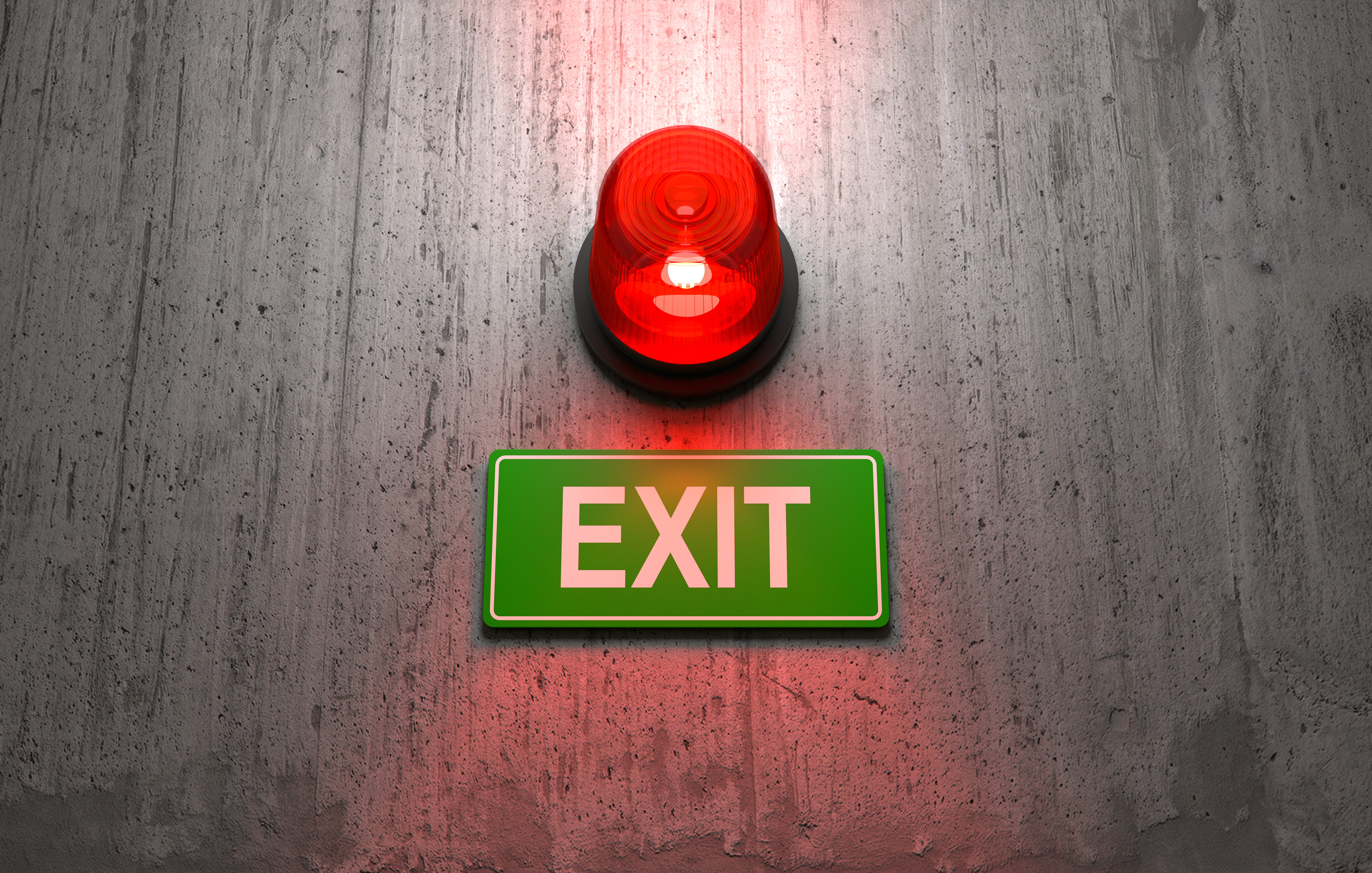 Green emergency exit sign glowing above a doorway