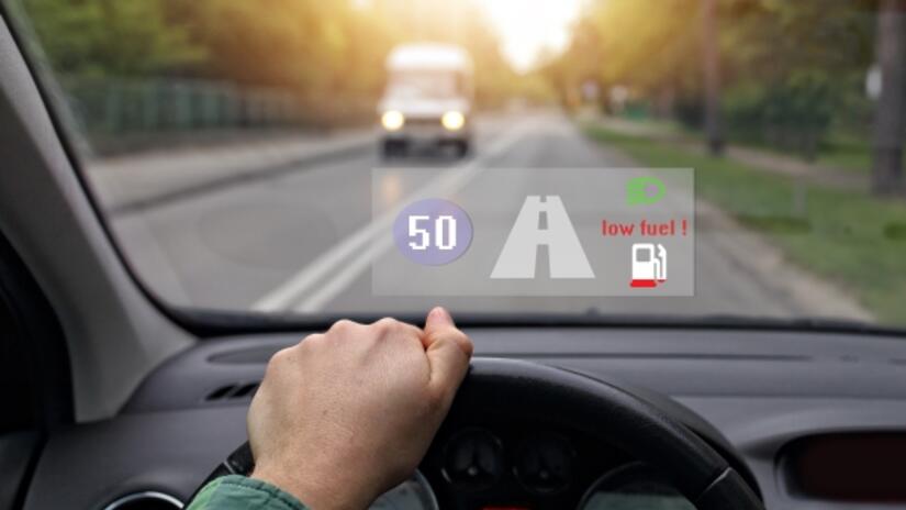 Heads-up display projected onto a vehicle windshield while driving Heads-up display projected onto a vehicle windshield while driving