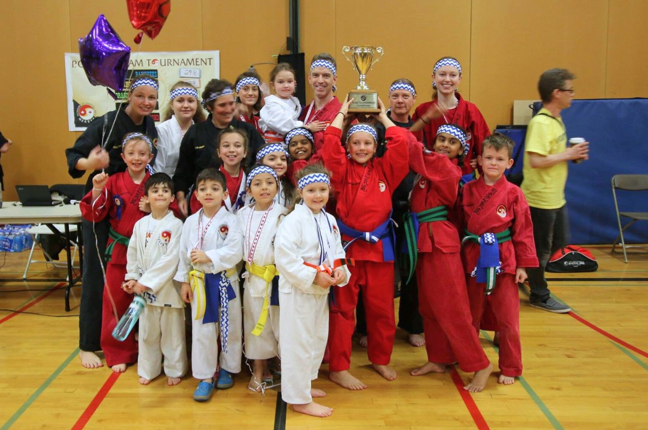 Martial arts instructor with kids