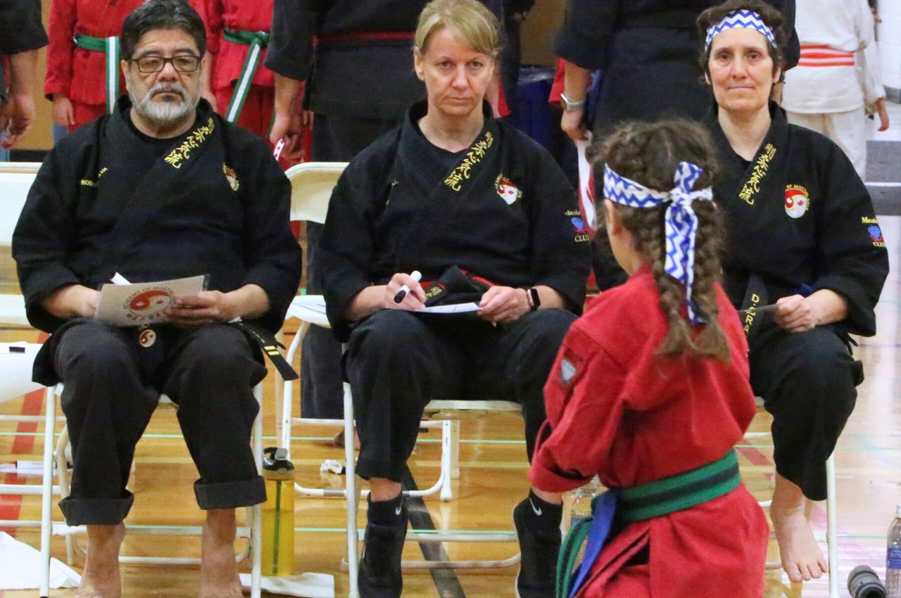 Martial arts instructor with kids