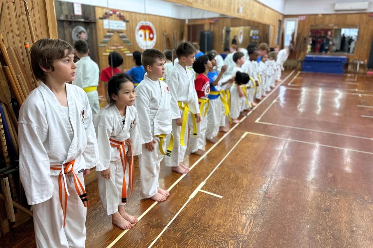 Martial arts instructor with kids