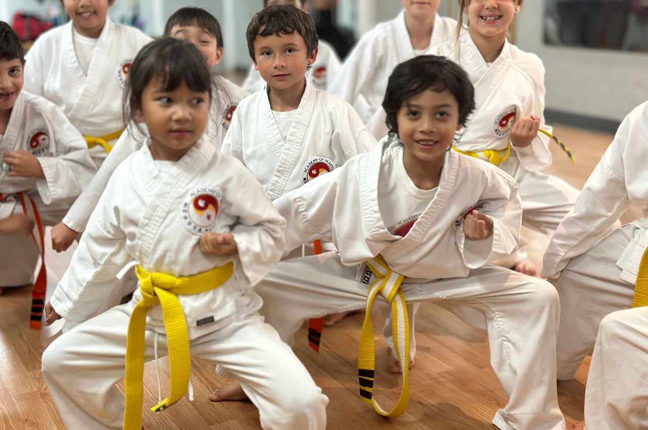 Martial arts instructor with kids