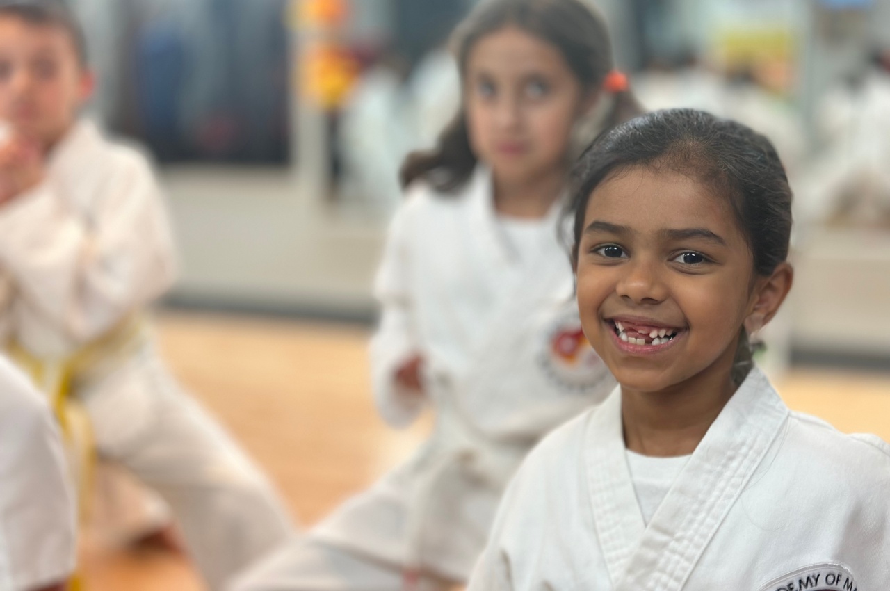 Martial arts instructor with kids