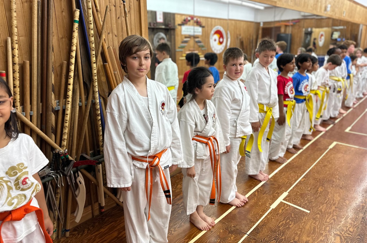 Martial arts instructor with kids