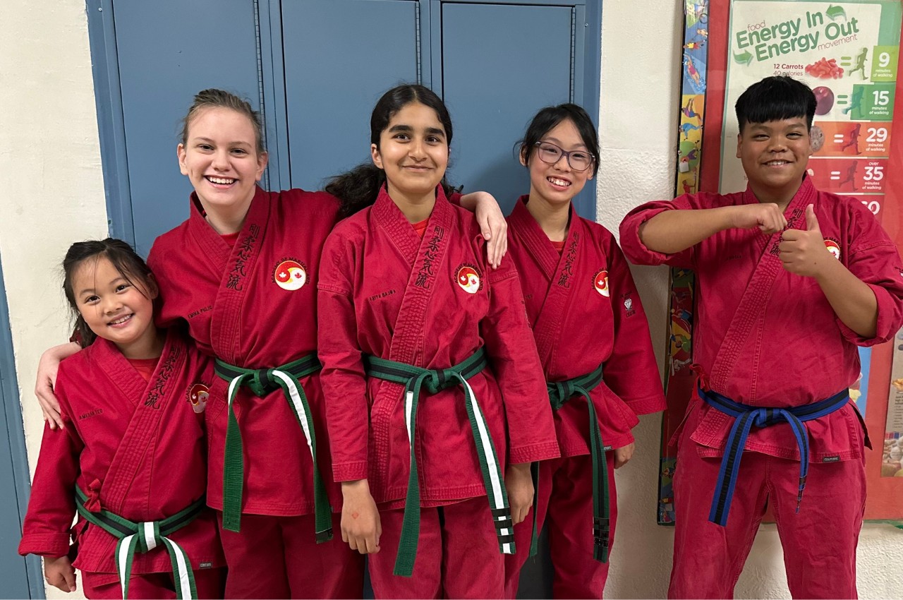 Martial arts instructor with kids