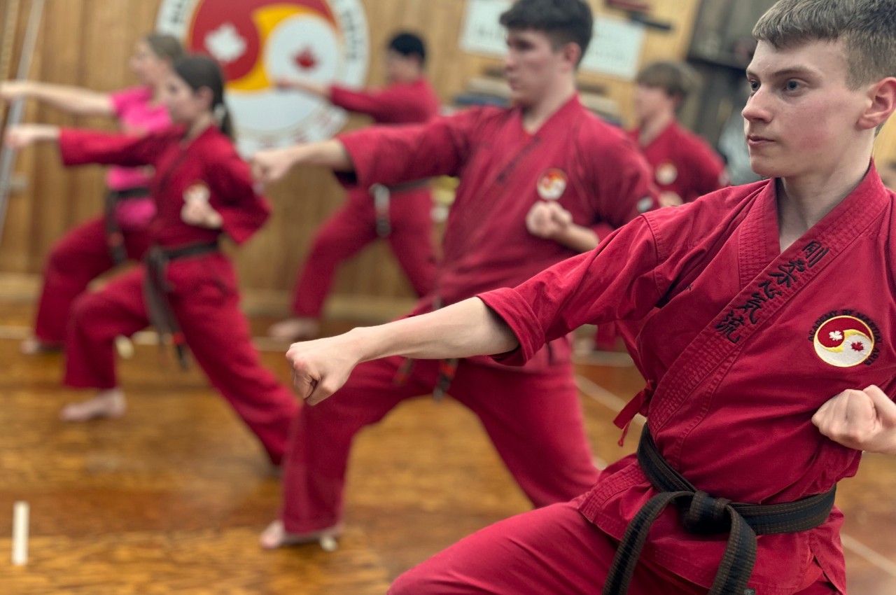 Martial arts instructor with kids