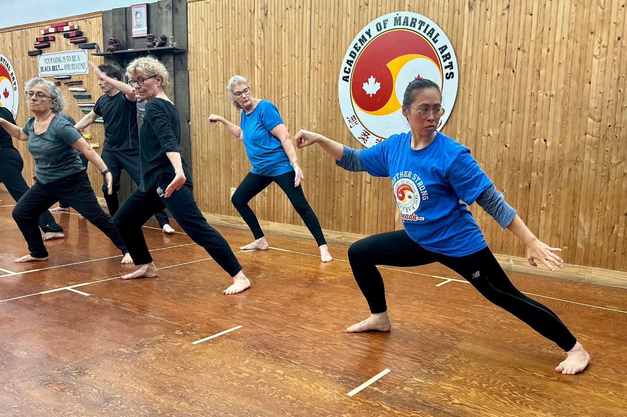 Martial arts instructor with kids