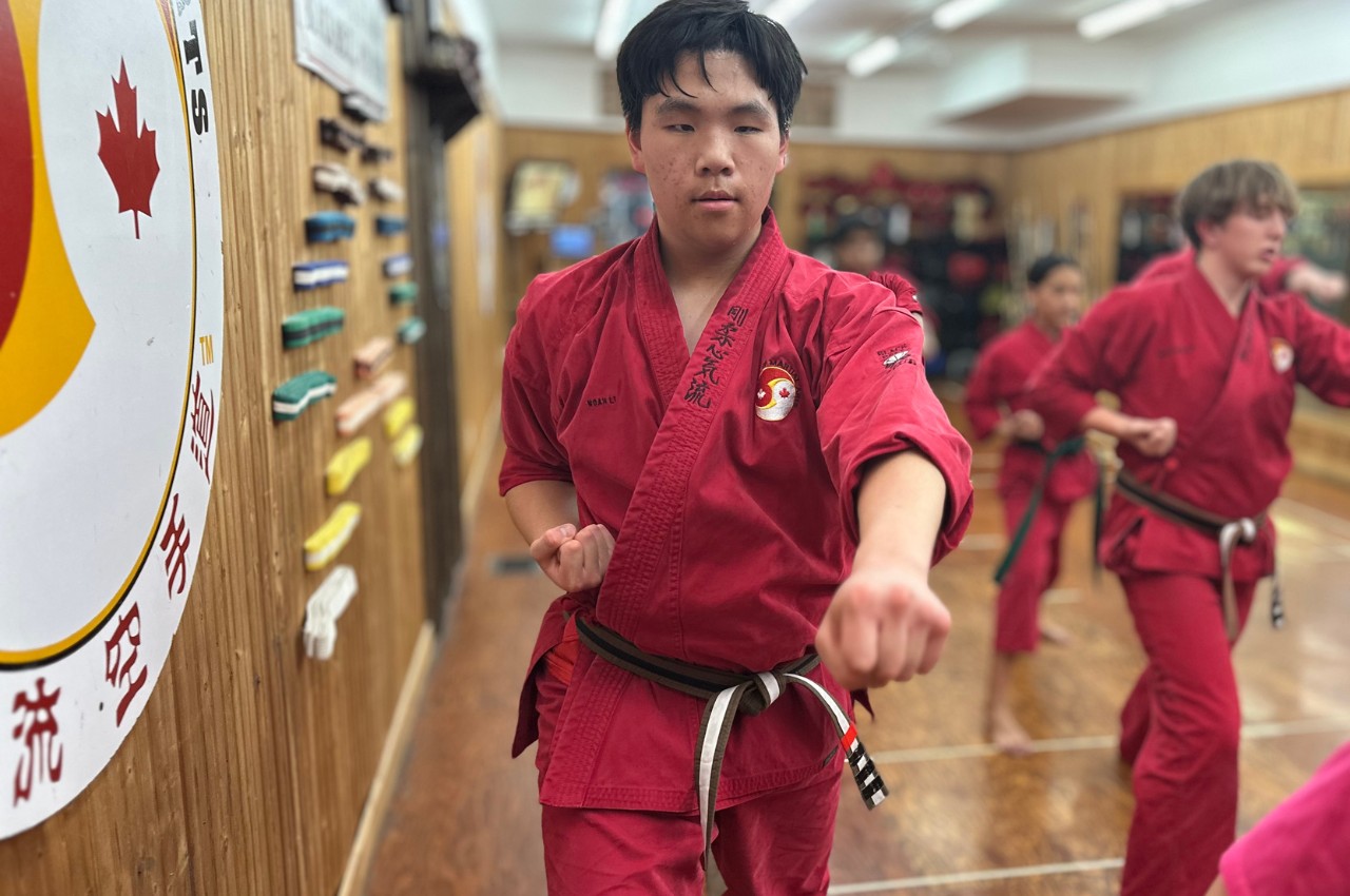 Martial arts instructor with kids