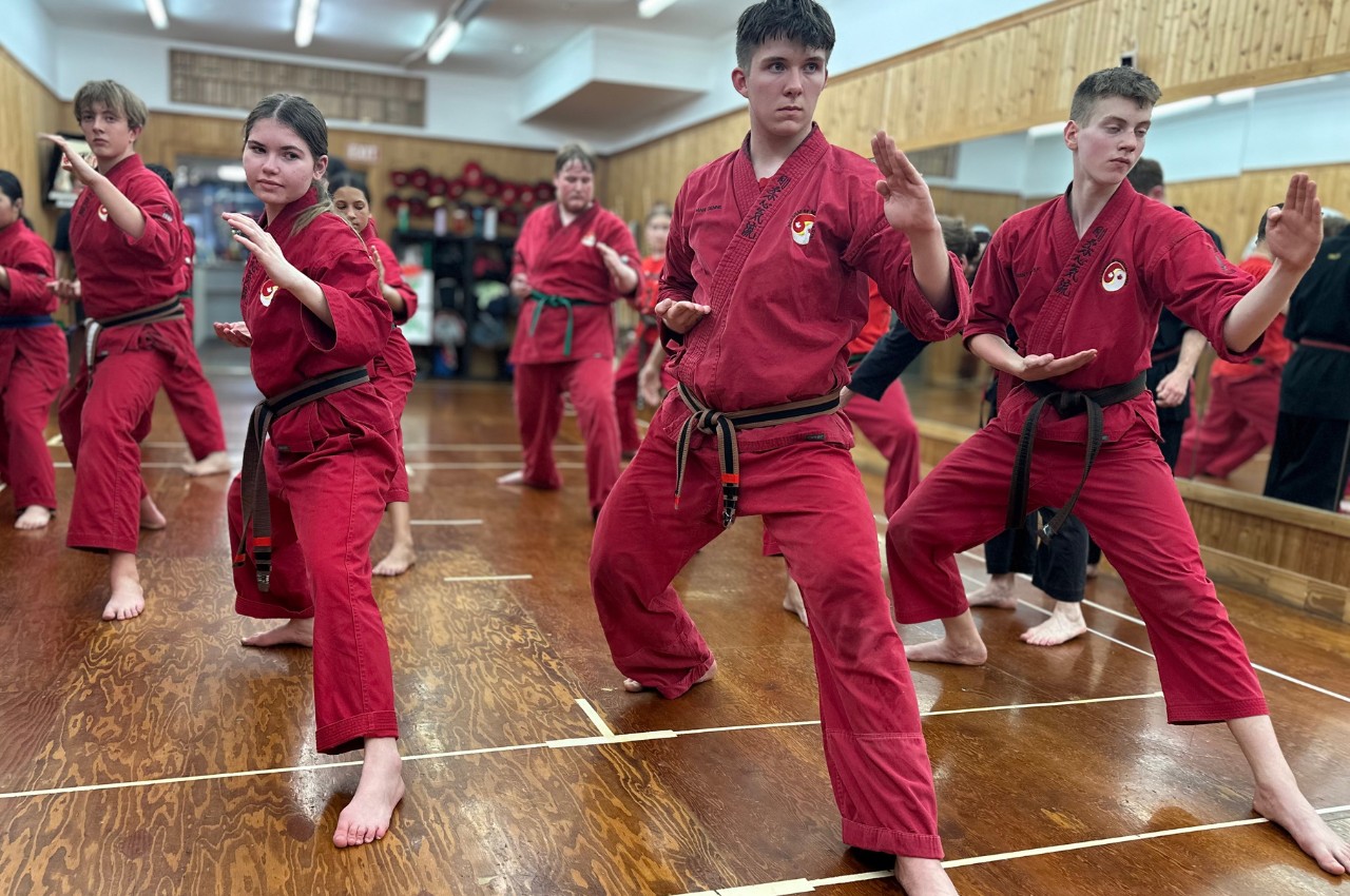 Martial arts instructor with kids