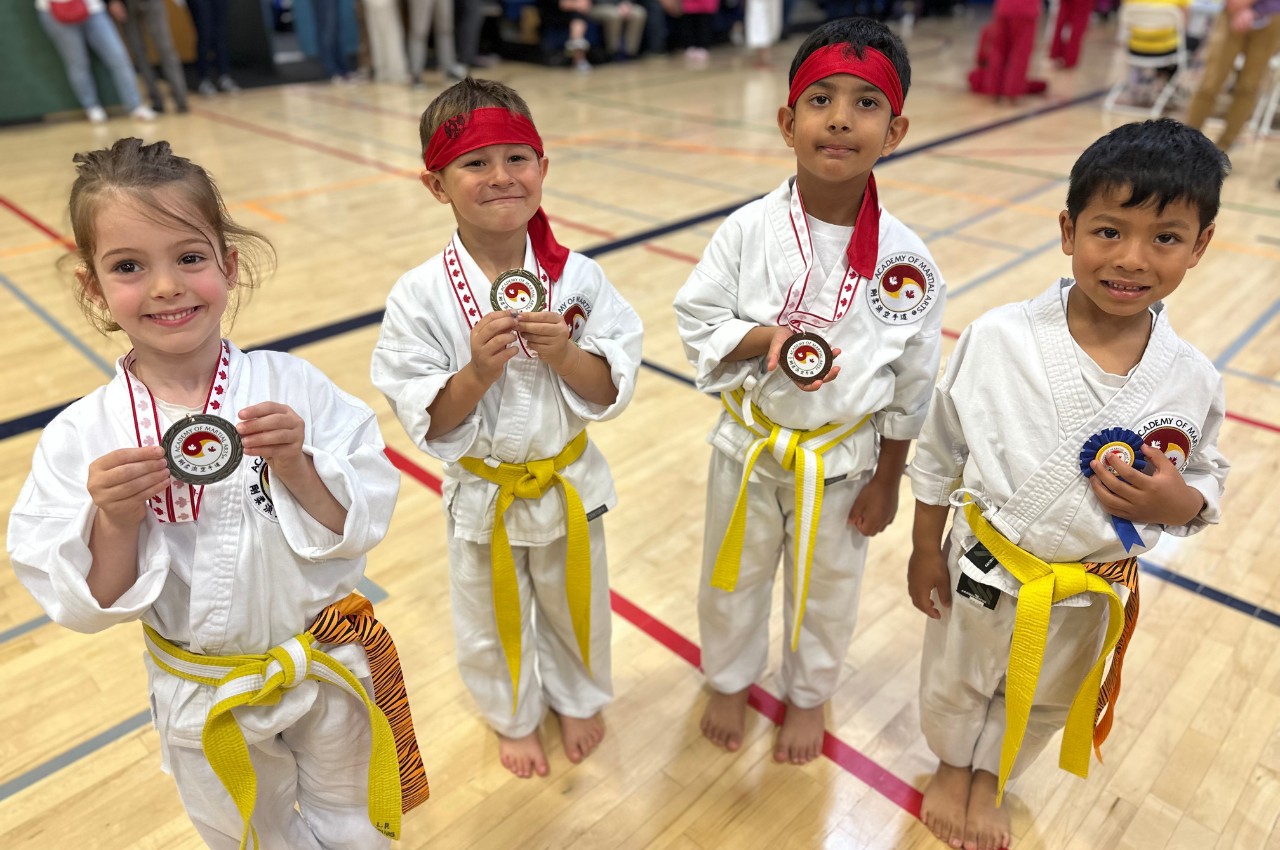 Martial arts instructor with kids